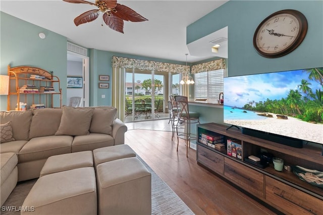 3045 Driftwood Way Unit 3707, Naples, FL 34109 - living area with a ceiling fan, a chandelier, and wood finished floors