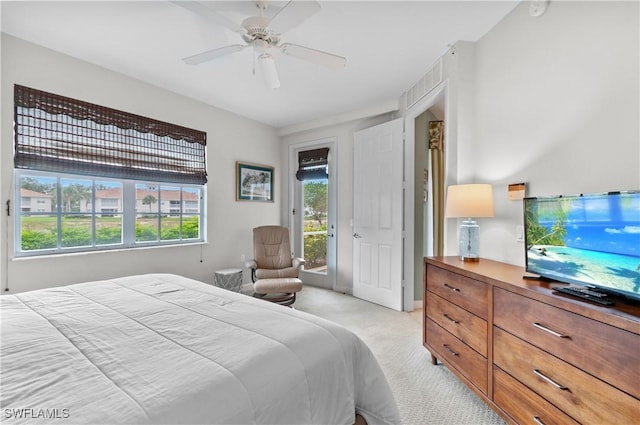 3045 Driftwood Way Unit 3707, Naples, FL 34109 - bedroom featuring light carpet, access to exterior, and a ceiling fan