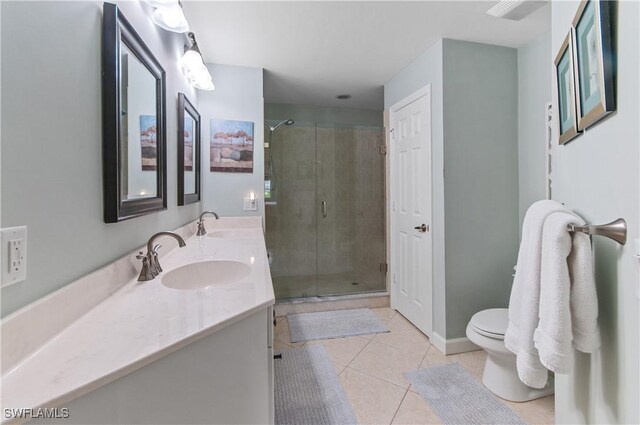 3045 Driftwood Way Unit 3707, Naples, FL 34109 - full bathroom with a stall shower, double vanity, tile patterned floors, and toilet