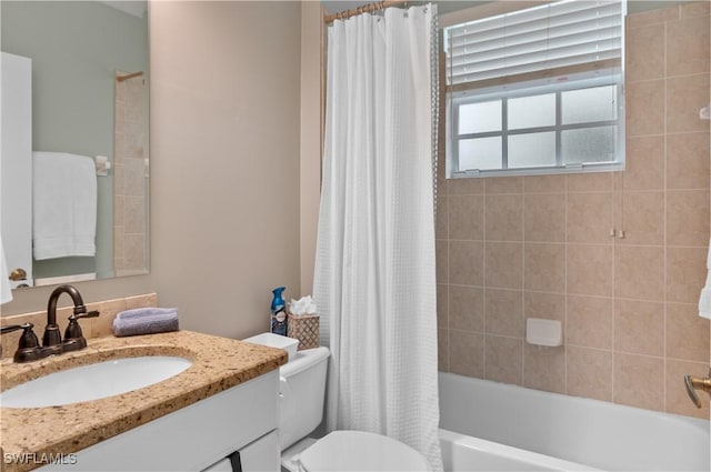 3045 Driftwood Way Unit 3707, Naples, FL 34109 - bathroom featuring toilet, vanity, and shower / bath combo with shower curtain