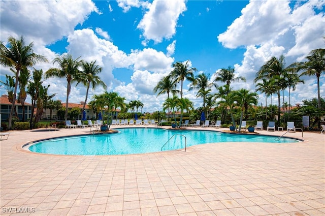 3045 Driftwood Way Unit 3707, Naples, FL 34109 - community pool featuring a patio