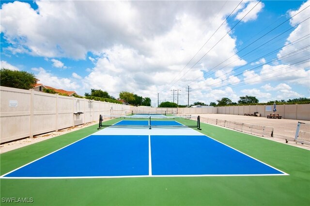 3045 Driftwood Way Unit 3707, Naples, FL 34109 - view of tennis court with fence