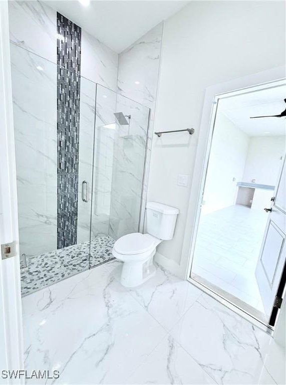 1312 Oak Ave, Lehigh Acres, FL 33972 - bathroom with a marble finish shower, toilet, marble finish flooring, and baseboards