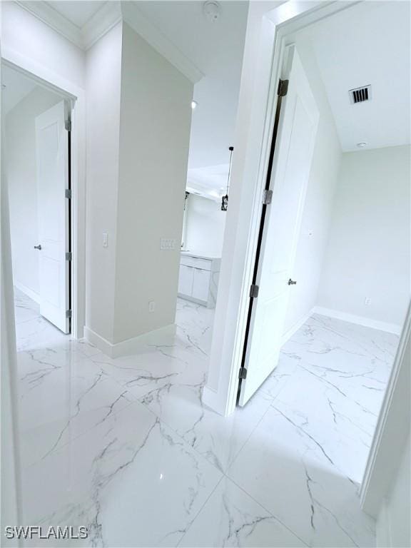 1312 Oak Ave, Lehigh Acres, FL 33972 - hallway featuring marble finish flooring and baseboards