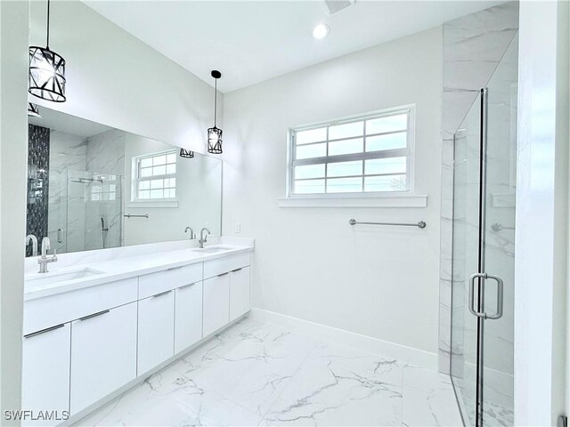 1312 Oak Ave, Lehigh Acres, FL 33972 - bathroom featuring marble finish flooring, a marble finish shower, baseboards, and double vanity