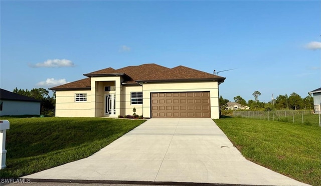 1312 Oak Ave, Lehigh Acres, FL 33972 - view of front of house with a garage, stucco siding, and driveway