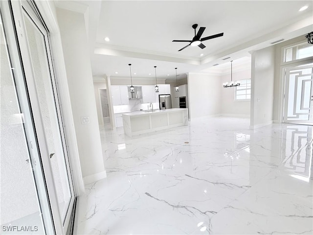 1312 Oak Ave, Lehigh Acres, FL 33972 - unfurnished living room with a sink, light marble finish flooring, recessed lighting, ceiling fan, and a tray ceiling