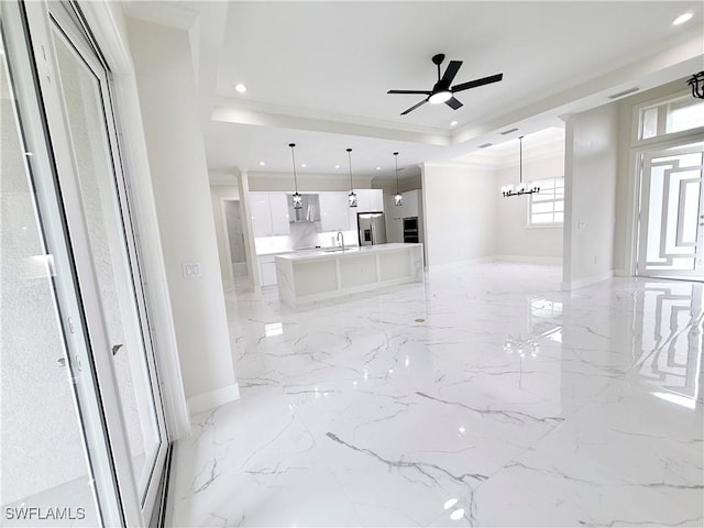 1312 Oak Ave, Lehigh Acres, FL 33972 - unfurnished living room featuring a sink, light marble finish floors, recessed lighting, crown molding, and a ceiling fan
