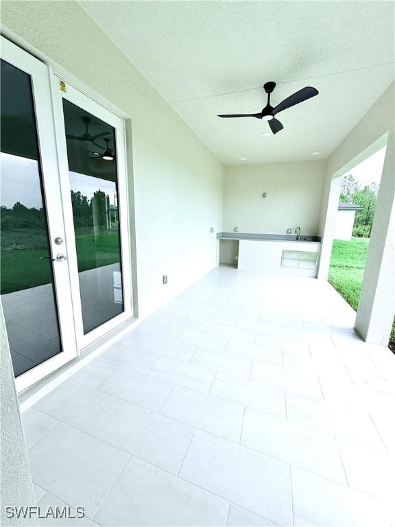 1312 Oak Ave, Lehigh Acres, FL 33972 - view of patio / terrace with french doors and ceiling fan