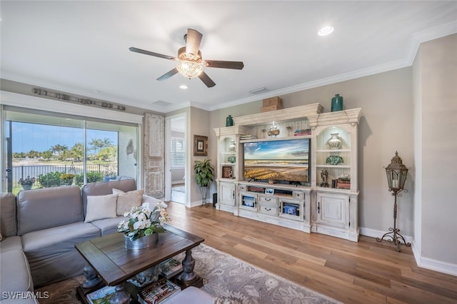 28268 Seasons Tide Ave, Bonita Springs, FL 34135 - living room with a ceiling fan, wood finished floors, crown molding, and recessed lighting