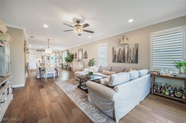 28268 Seasons Tide Ave, Bonita Springs, FL 34135 - living room featuring a ceiling fan, crown molding, wood finished floors, and recessed lighting