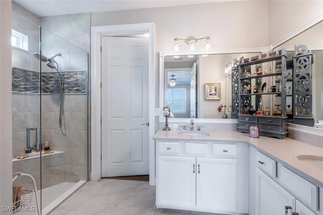 28268 Seasons Tide Ave, Bonita Springs, FL 34135 - bathroom featuring a stall shower, double vanity, tile patterned floors, and a ceiling fan