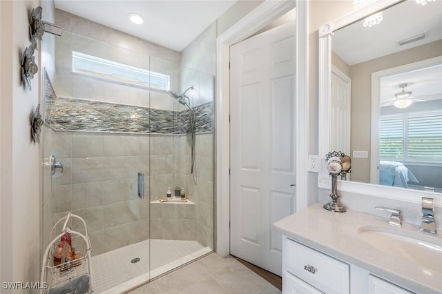 28268 Seasons Tide Ave, Bonita Springs, FL 34135 - ensuite bathroom with a shower stall, vanity, tile patterned flooring, and a ceiling fan