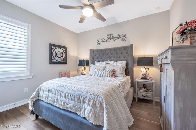 28268 Seasons Tide Ave, Bonita Springs, FL 34135 - bedroom with wood finished floors, multiple windows, and ceiling fan