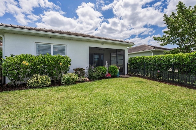 28268 Seasons Tide Ave, Bonita Springs, FL 34135 - back of property with stucco siding and a sunroom