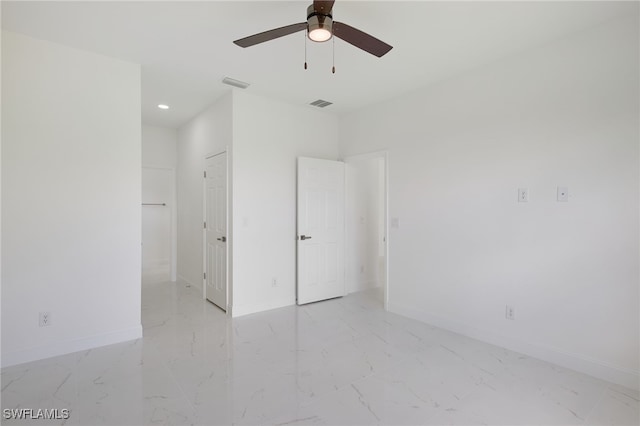 empty room featuring light marble finish floors, baseboards, ceiling fan, and recessed lighting