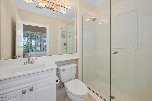 full bathroom featuring a stall shower, ornamental molding, a chandelier, toilet, and vanity