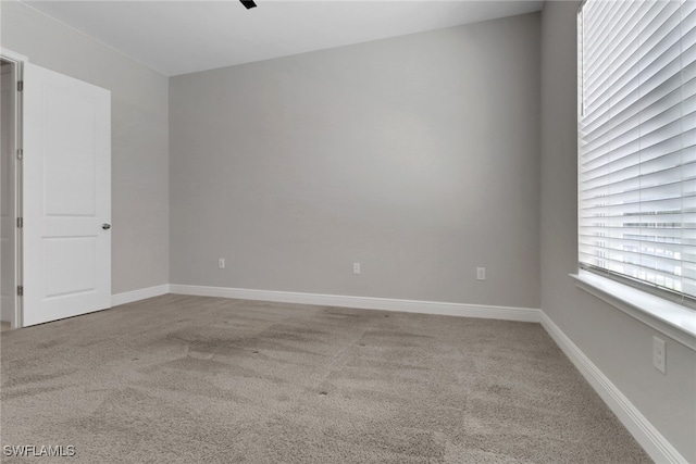 3307 Pilot Cir, Naples, FL 34120 - spare room featuring carpet and baseboards