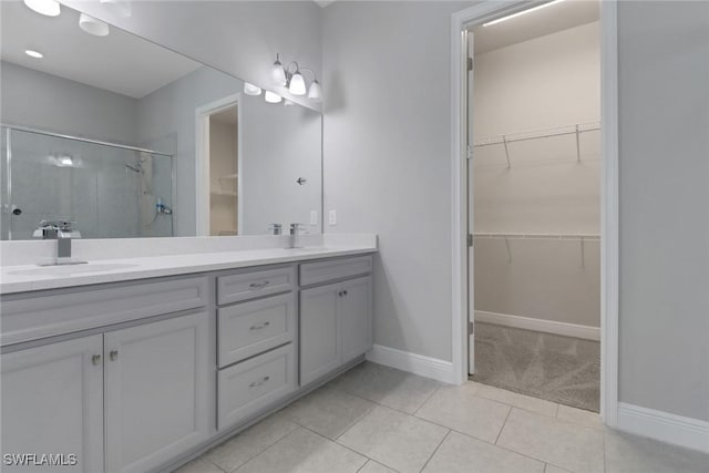 3307 Pilot Cir, Naples, FL 34120 - full bath with a stall shower, double vanity, tile patterned flooring, and baseboards