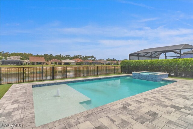 3307 Pilot Cir, Naples, FL 34120 - view of pool with a patio area, a fenced backyard, a water view, a pool with connected hot tub, and a residential view