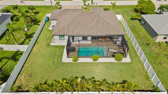 aerial view of property and surrounding area with a pool area