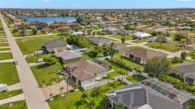 aerial view of residential area with a nearby body of water