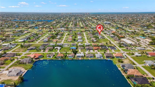 aerial overview of property's location with nearby suburban area and a nearby body of water