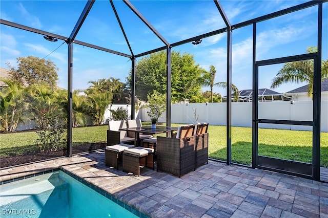 view of swimming pool featuring a patio, glass enclosure, and outdoor dining space