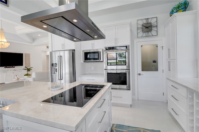 1070 Dana Ct, Marco Island, FL 34145 - kitchen featuring appliances with stainless steel finishes, exhaust hood, a center island, recessed lighting, and white cabinets