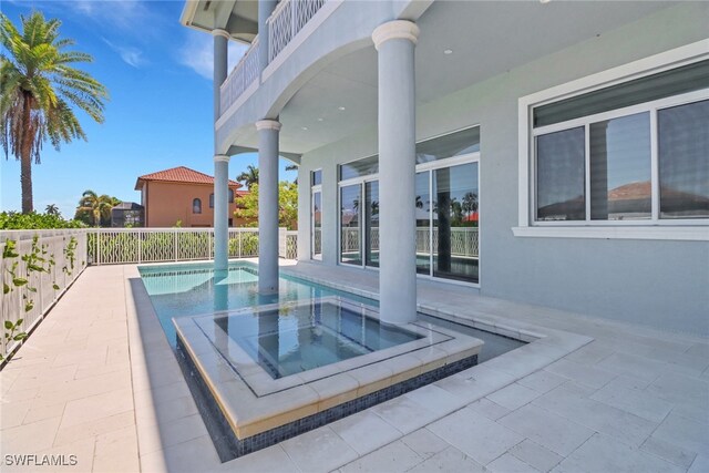 1070 Dana Ct, Marco Island, FL 34145 - view of swimming pool featuring a pool with connected hot tub and a patio area