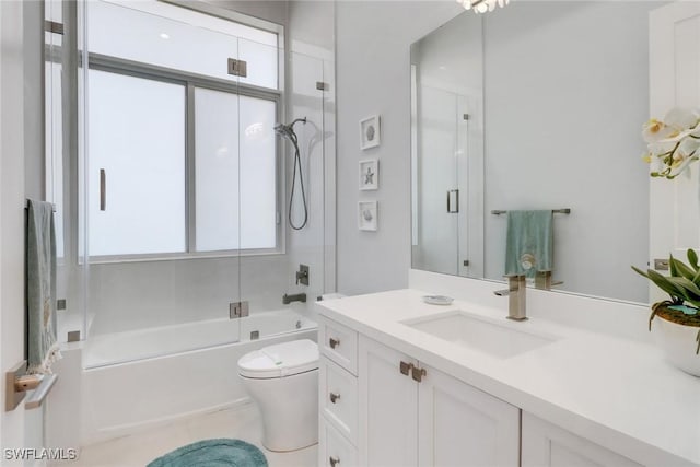 1070 Dana Ct, Marco Island, FL 34145 - full bath featuring toilet, vanity, and bath / shower combo with glass door