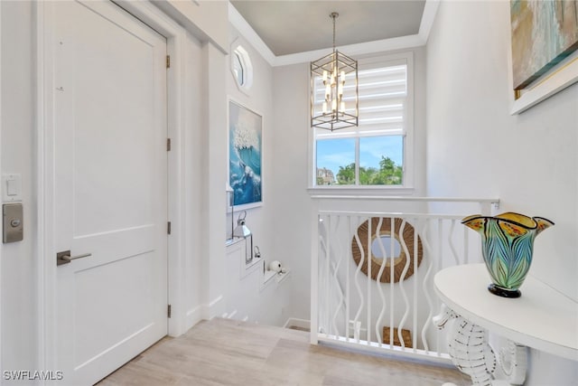 1070 Dana Ct, Marco Island, FL 34145 - hallway featuring a chandelier, crown molding, and baseboards