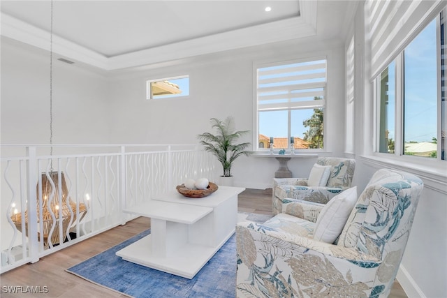1070 Dana Ct, Marco Island, FL 34145 - sitting room with a raised ceiling, plenty of natural light, wood finished floors, and crown molding