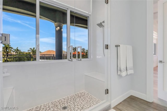 1070 Dana Ct, Marco Island, FL 34145 - full bath with baseboards, a stall shower, and wood finished floors