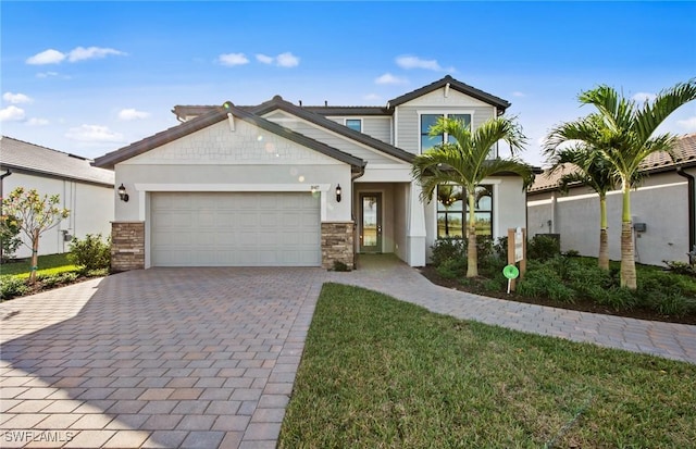 20665 Napa Loop, Estero, FL 33928 - view of front of property with an attached garage, decorative driveway, stucco siding, and stone siding