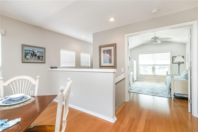 dining room with light wood-style floors, ceiling fan, baseboards, recessed lighting, and lofted ceiling