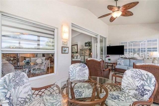 living room featuring lofted ceiling and ceiling fan