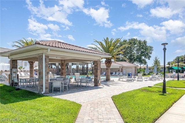 view of home's community featuring a yard, a gazebo, a pool, and a patio area
