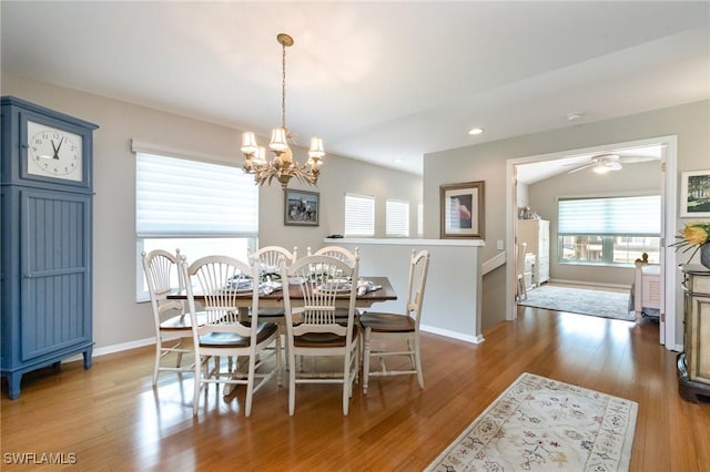 dining space with a chandelier, baseboards, wood finished floors, ceiling fan, and recessed lighting