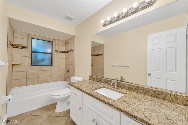 full bath with tile patterned floors, toilet, vanity, and washtub / shower combination