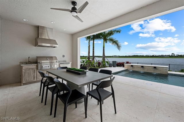 9102 Wisteria Way, Naples, FL 34114 - dining space featuring a textured ceiling, a ceiling fan, and a water view