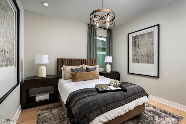 9102 Wisteria Way, Naples, FL 34114 - bedroom featuring light wood finished floors, a chandelier, baseboards, and recessed lighting