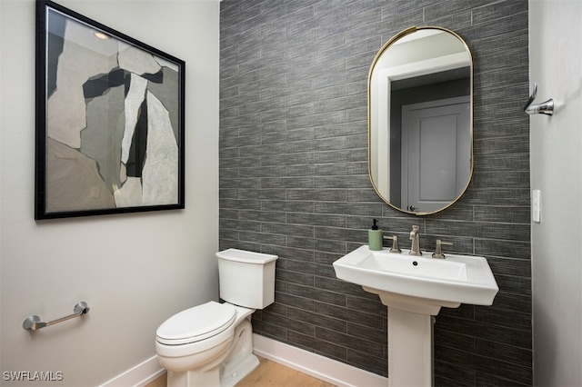 9102 Wisteria Way, Naples, FL 34114 - half bathroom featuring toilet and baseboards