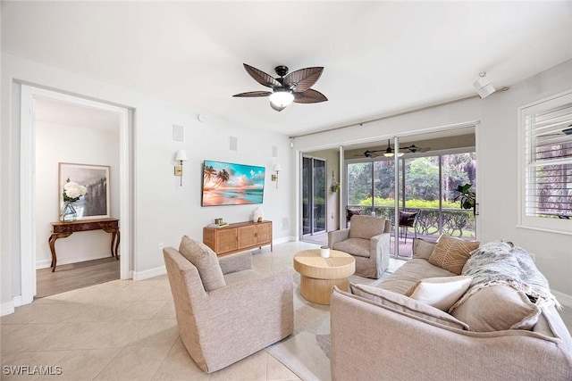 1786 Tarpon Bay Dr S Unit 102, Naples, FL 34119 - living room with a ceiling fan, light tile patterned floors, and baseboards