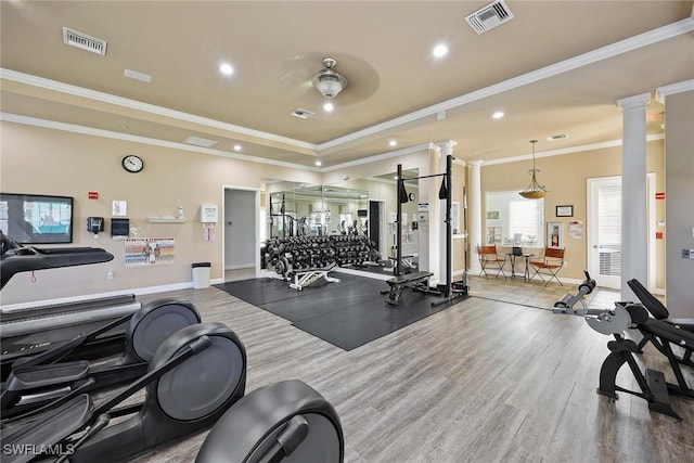 1786 Tarpon Bay Dr S Unit 102, Naples, FL 34119 - gym featuring decorative columns, a raised ceiling, baseboards, recessed lighting, and crown molding