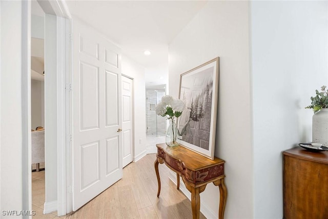 1786 Tarpon Bay Dr S Unit 102, Naples, FL 34119 - corridor featuring light wood-style floors, recessed lighting, and baseboards