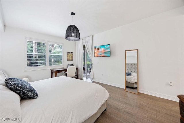 1786 Tarpon Bay Dr S Unit 102, Naples, FL 34119 - bedroom with access to exterior, wood finished floors, baseboards, and a desk