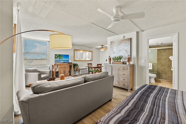 5900 Bonita Beach Rd # 1405, Bonita Springs, FL 34134 - living area featuring ceiling fan, light wood-style flooring, and a textured ceiling