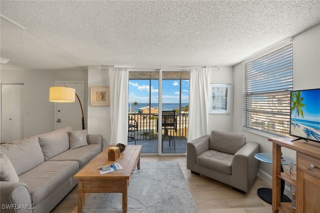 5900 Bonita Beach Rd # 1405, Bonita Springs, FL 34134 - living room featuring a textured ceiling