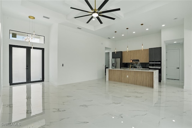 103 Chiquita Blvd N, Cape Coral, FL 33993 - kitchen featuring a high ceiling, open floor plan, modern cabinets, recessed lighting, and appliances with stainless steel finishes